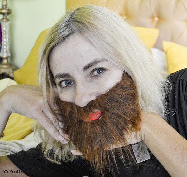 woman with beard trying to act seductive and pretty