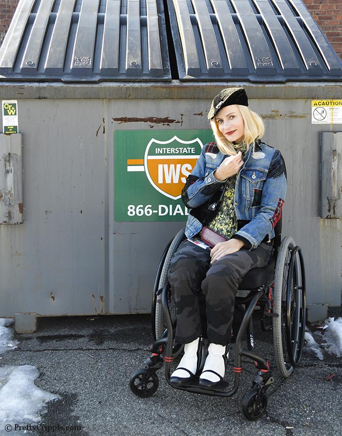 Wheelchair disabled fashion blogger PrettyCripple - Dumpster Diving for fashion week. Seen wearing a Junya Watanabe denim jacket.