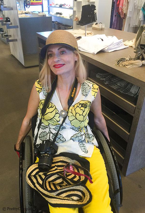Wheelchair fashion blogger in ecstasy over a Eugenia Kim hat