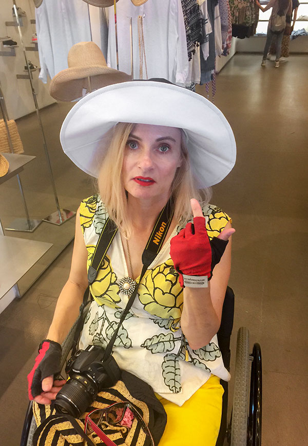 Wheelchair fashion blogger in Scoop NYC sun hat - Meatpacking district