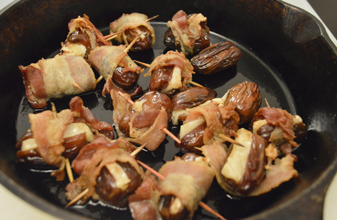 bacon, dates and cheese served in a cast iron skillet