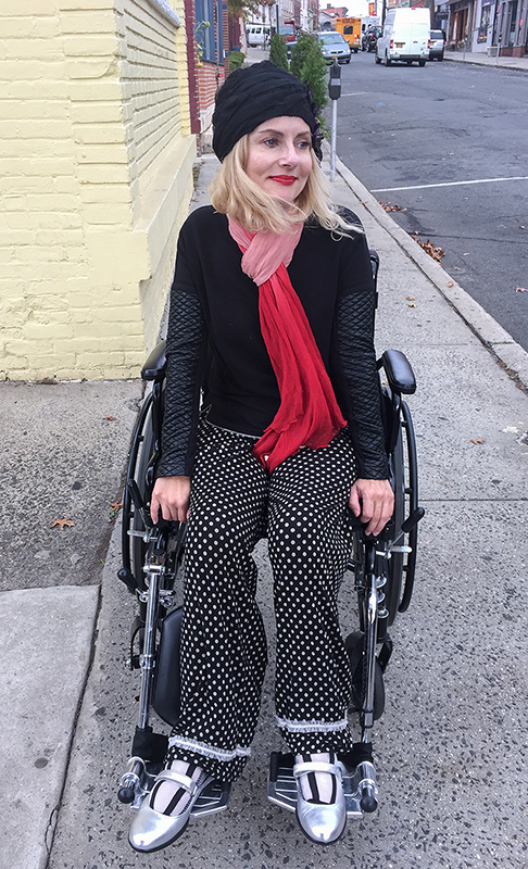 Pretty Cripple wheelchair streetstyle wearing Prada maryjanes and Generation Love faux leather sweatshirt