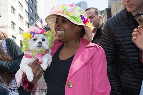 woman with couture dog at the easter hat parade in NYC