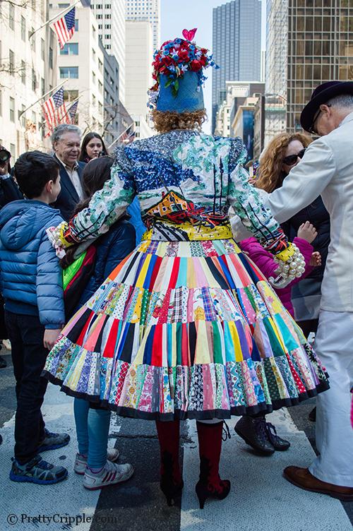 Lady with sequin jacket and patchwork dress easter hat parade nyc